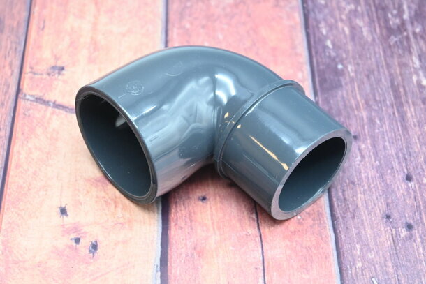 PVC Winkel 90° reduziert Klebemuffe 50/63mm x 63mm PN16